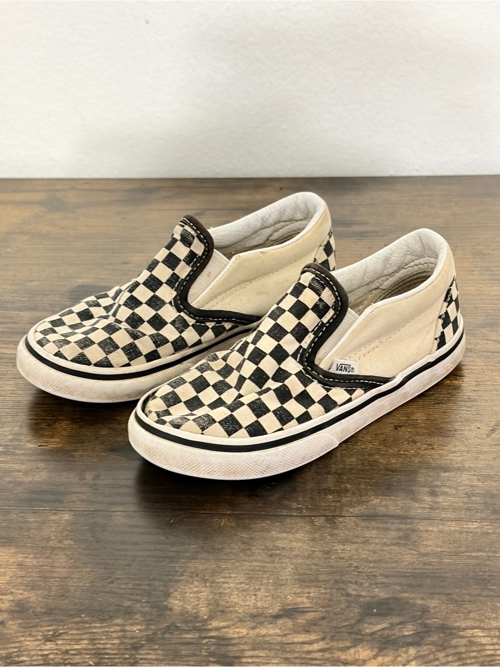 Vans Kids Slip-On Checkerboard Sneakers in Black and Cream